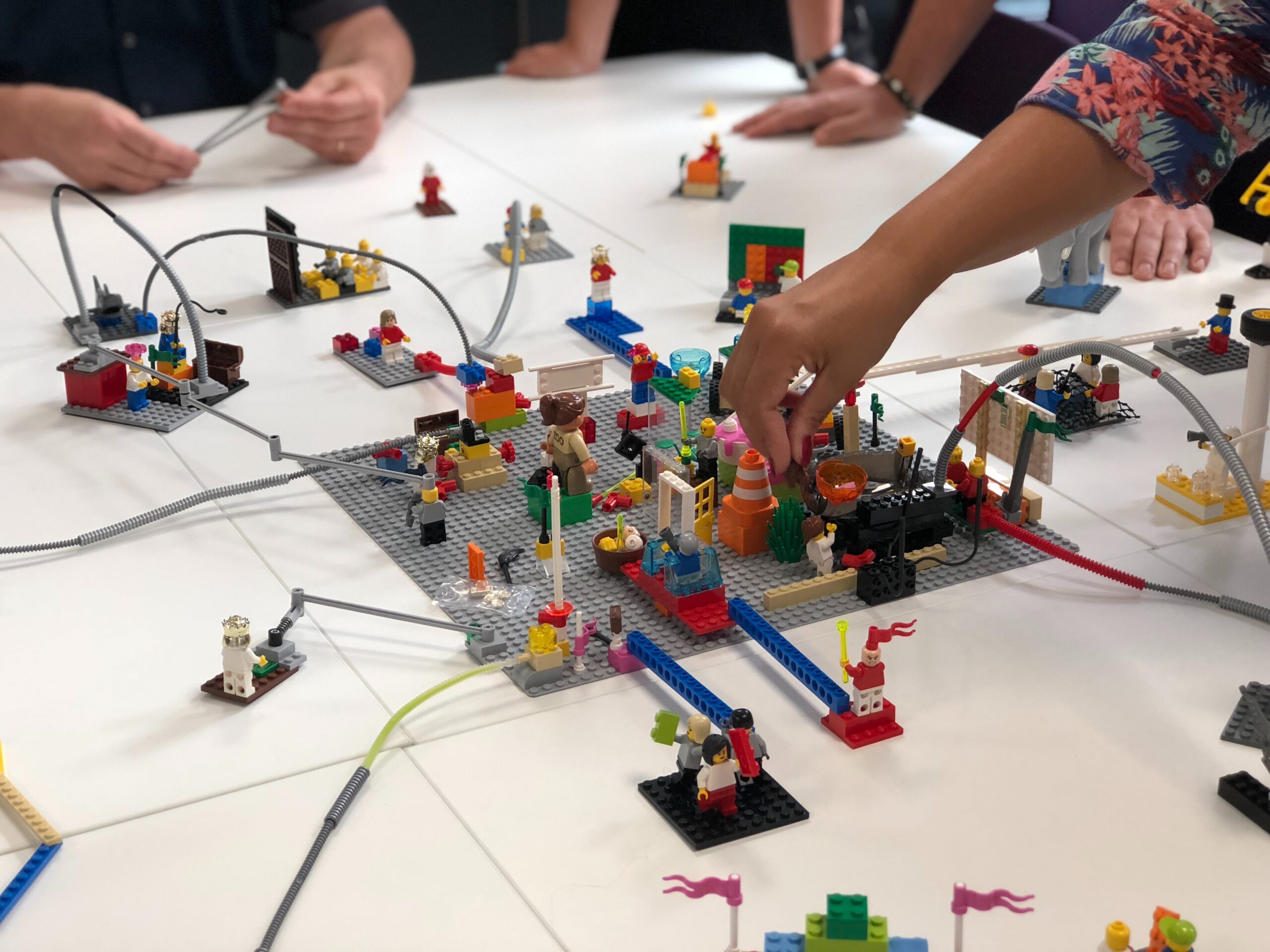 Image: Photograph of hands building something with LEGO®.